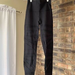 Black high rise lululemon leggings with cutouts